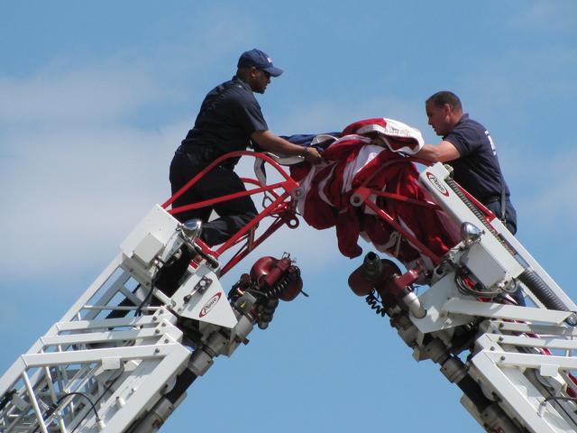 Preparing the flag of the United States of America in honor of Sergeant Hector Alaya.
<br><br>
End of Watch - 4 April 2010